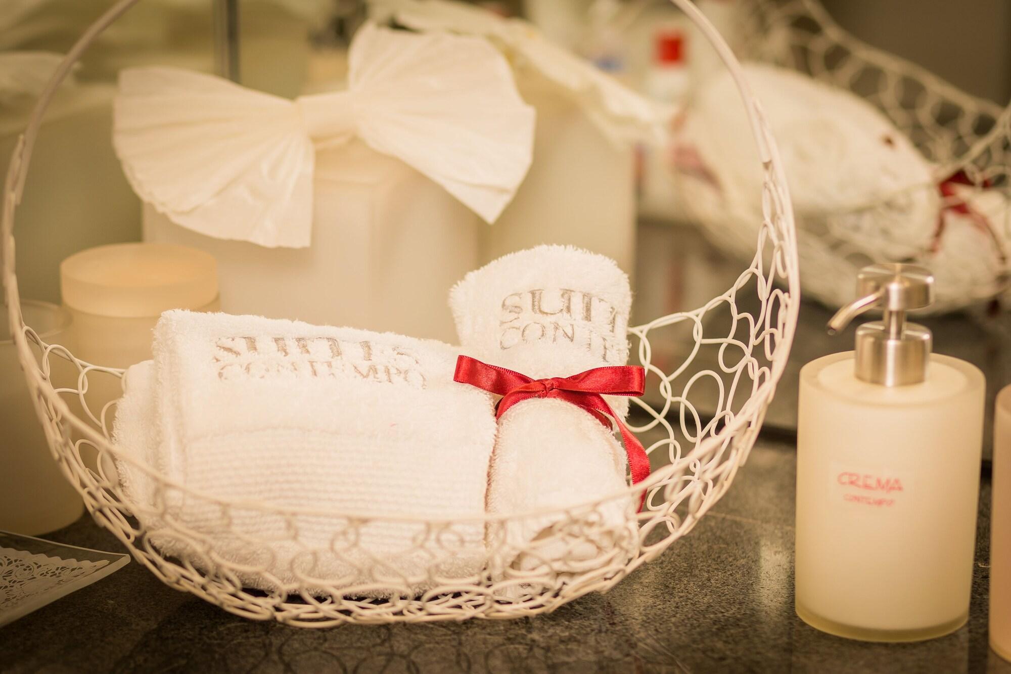 Suites Contempo Mexico Extérieur photo A basket of towels