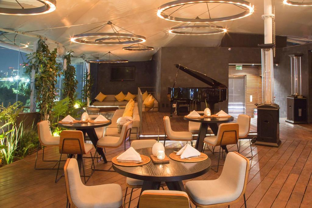 Suites Contempo Mexico Extérieur photo The interior of the restaurant
