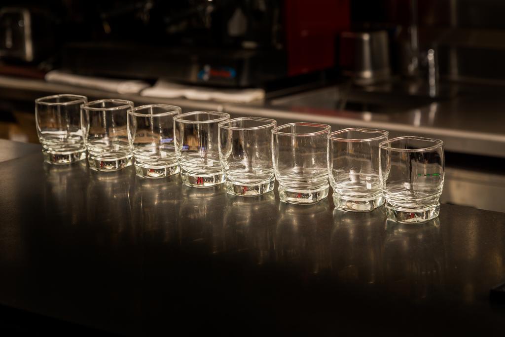 Suites Contempo Mexico Extérieur photo A row of shot glasses