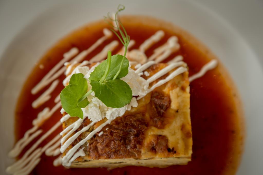 Suites Contempo Mexico Extérieur photo A piece of quiche with a garnish