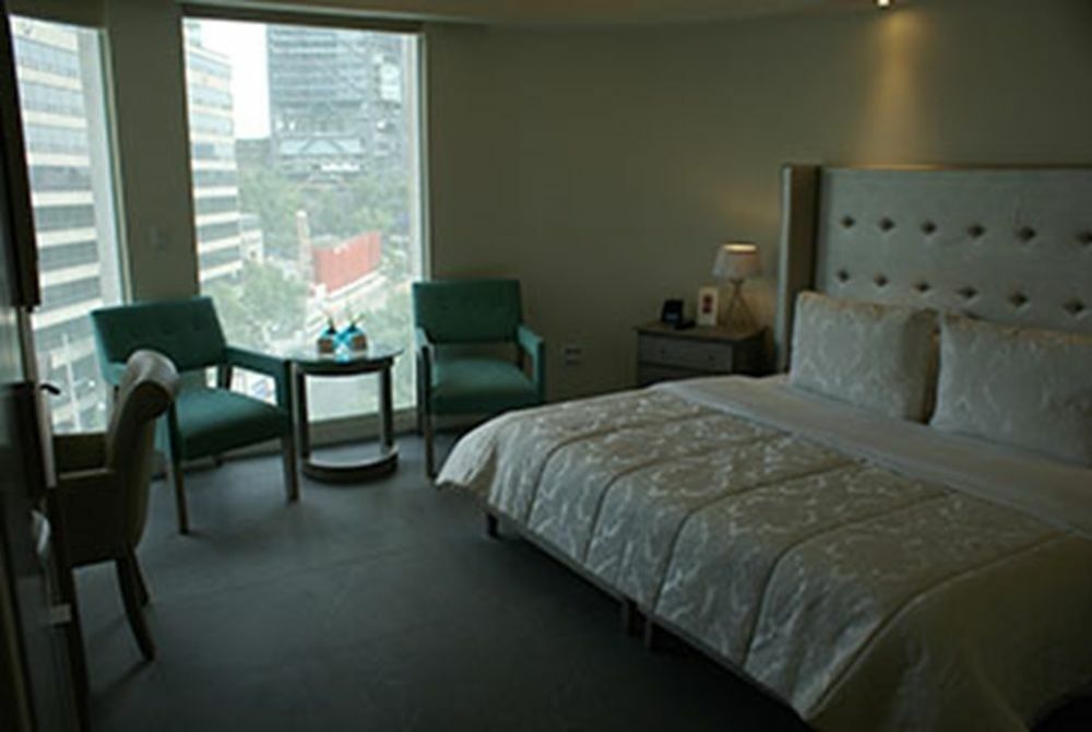 Suites Contempo Mexico Extérieur photo A room at the hotel
